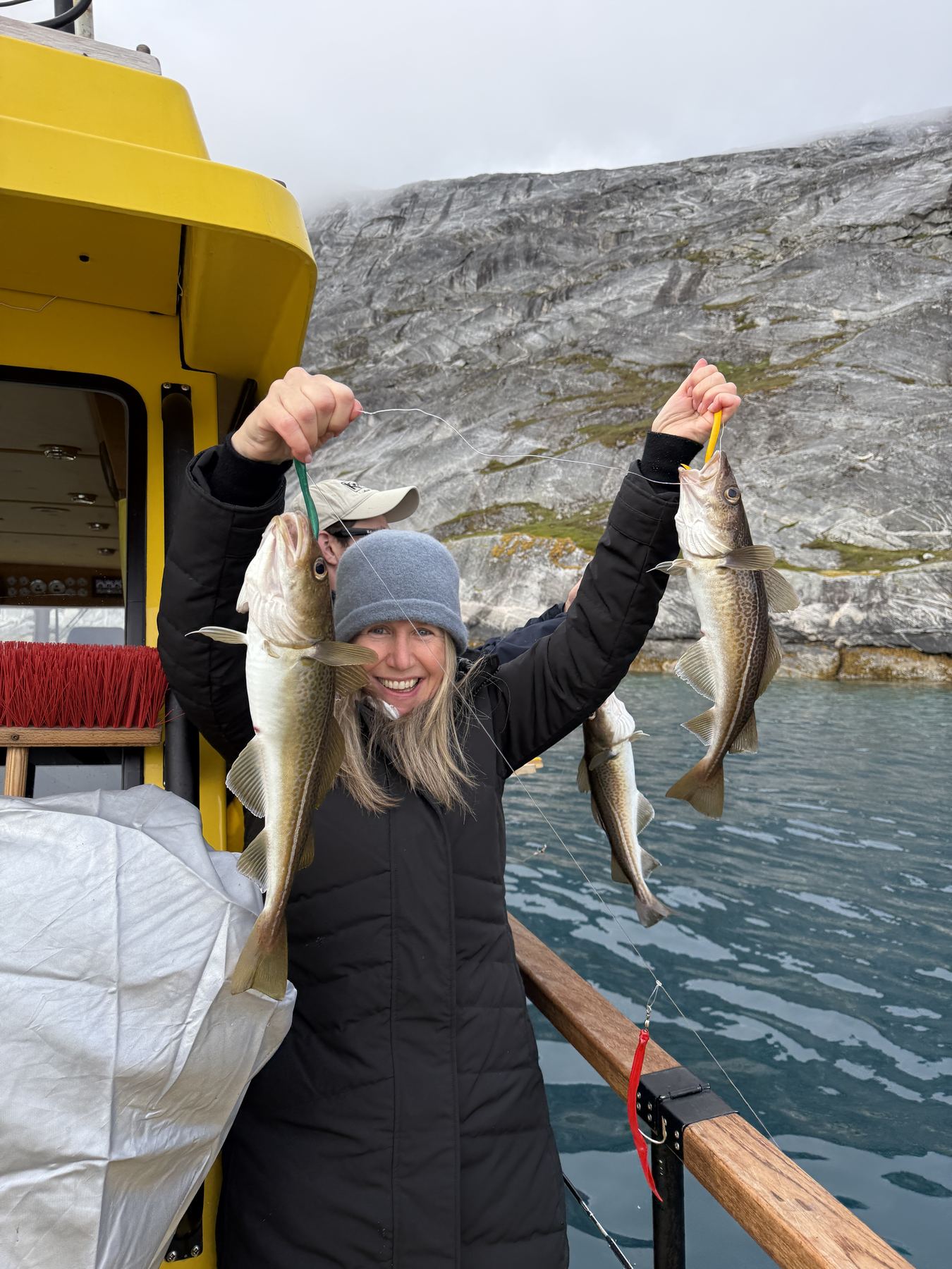 Rachel Friem holding Atlantic cod caught during a Nuuk Water Taxi fishing excursion